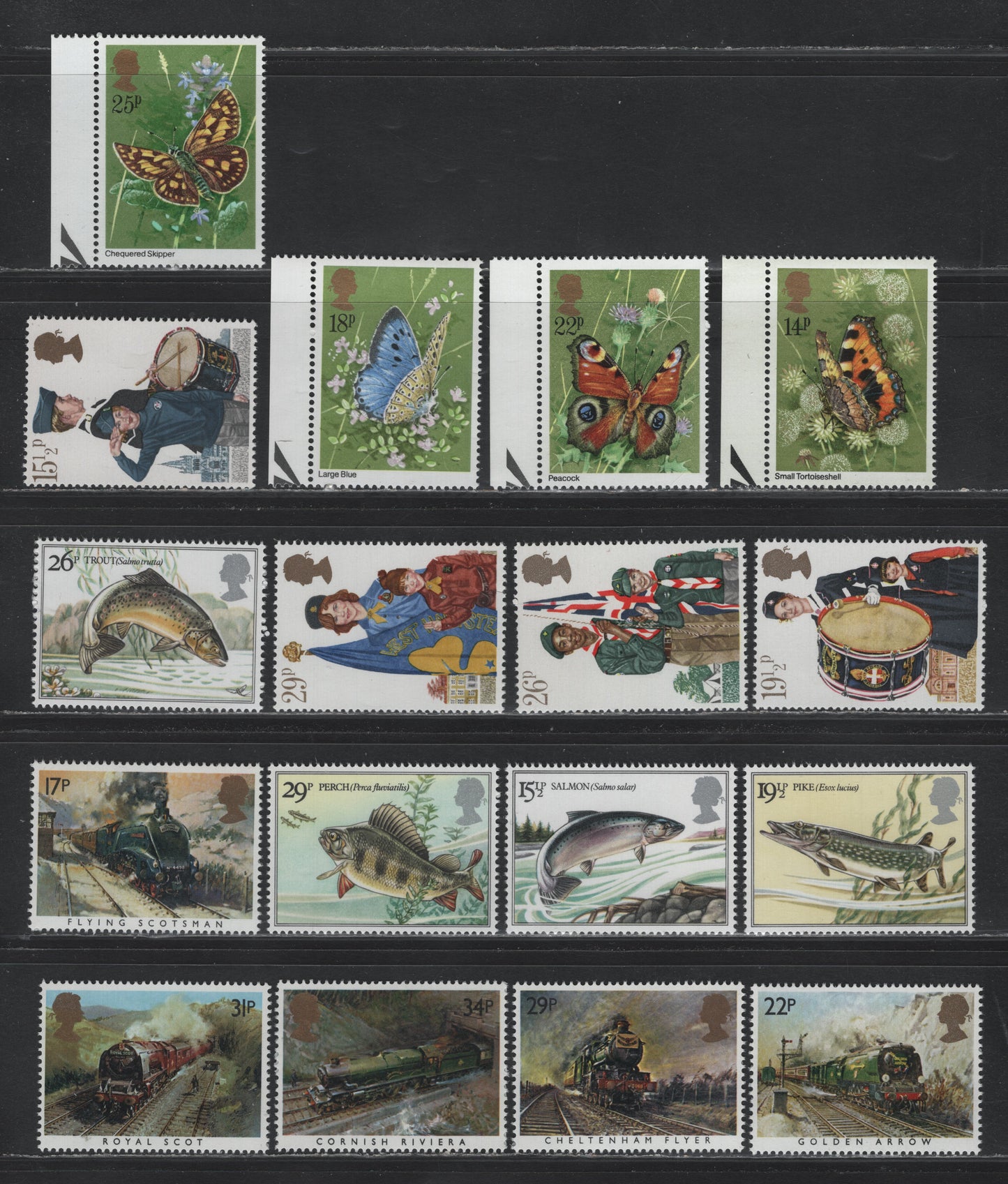 Lot 215 Great Britain SG#941-944, 983-986, 1011-1014, 1093-1097 14p - 34p Multicolored , 1981-1985 Butterflies - Trains Issues, 17 VFNH Singles