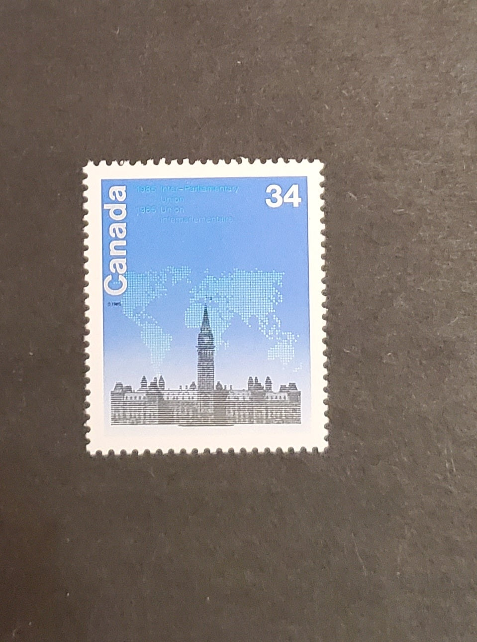 Lot 92 Canada #1061var 34c Multicoloured Parliament Buildings & World Map, 1985 Inter-Parliamentary Union Conference Issues, A VFNH Single Scarcer HF/DF Rolland Paper, Scarcer Than Unitrade Suggests