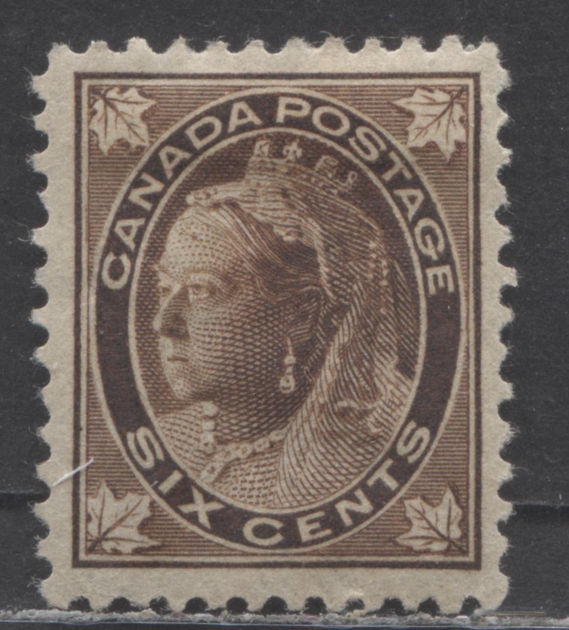 Lot 53 Canada #71 6c Brown Queen Victoria, 1897-1898 Maple Leaf Issue, A VFOG Single On Vertical Wove Paper With Heavy Hinge Remnant & Misplaced Entry In Upper Left Frameline