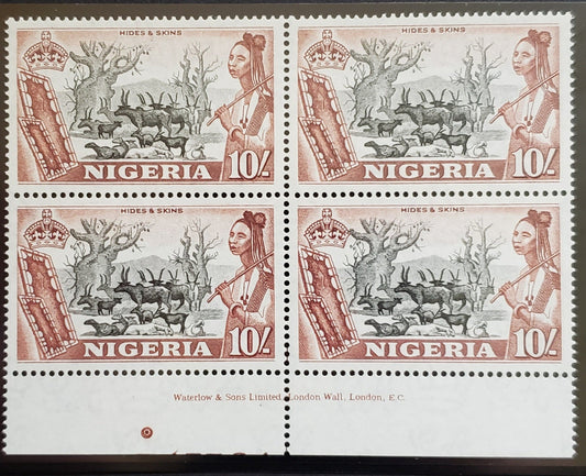 Lot 476 Nigeria #90 10/- Chocolate & Black Hides & Skins, 1953-1960 Queen Elizabeth II Pictorial Issue, A VFNH Bottom Sheet Margin Inscription Block Of 4 Likely The August 1954 Printing On White Paper, Showing Traces Of Number 45664 At Bottom of Selvedge