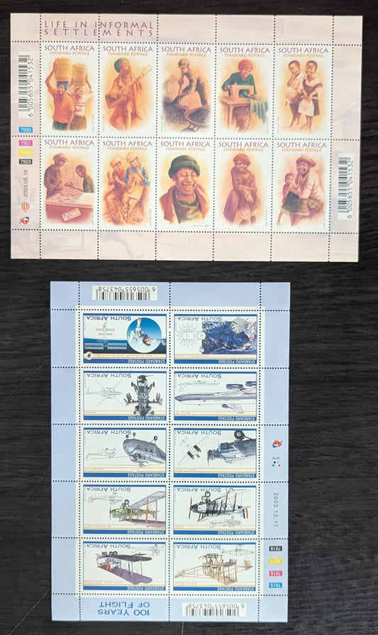 Lot 99 South Africa SC#1306/1331 2003 Life in Informal Settlements - Powered Flight Centenary Issues, 2 VFNH Souvenir Sheets, Click on Listing to See ALL Pictures, 2017 Scott Cat. $12.25