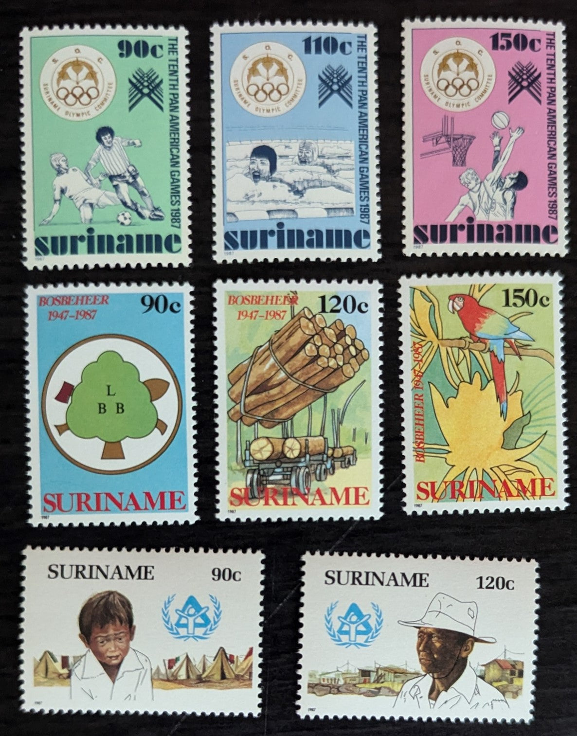 Lot 158 Surinam SC#763-770 1987 10th Pan-American Games, Indianapolis - Int'l Year of Shelter for the Homeless Issues, 8 VFNH Singles, Click on Listing to See ALL Pictures, 2017 Scott Cat. $15.25