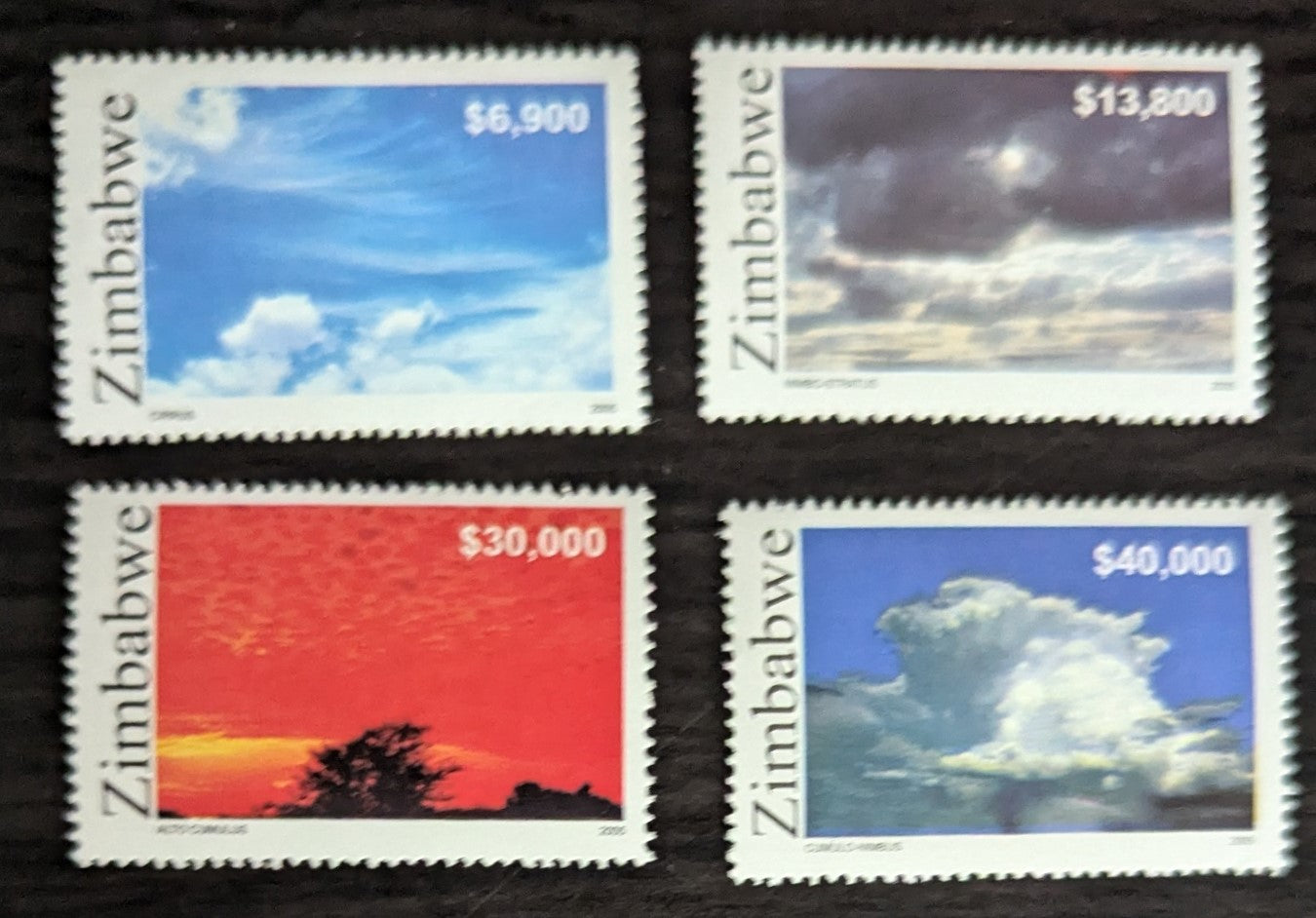 Lot 217 Zimbabwe SC#986-989 2005 Clouds issue, 4 VFNH Singles, Click on Listing to See ALL Pictures, 2017 Scott Cat. $17.5