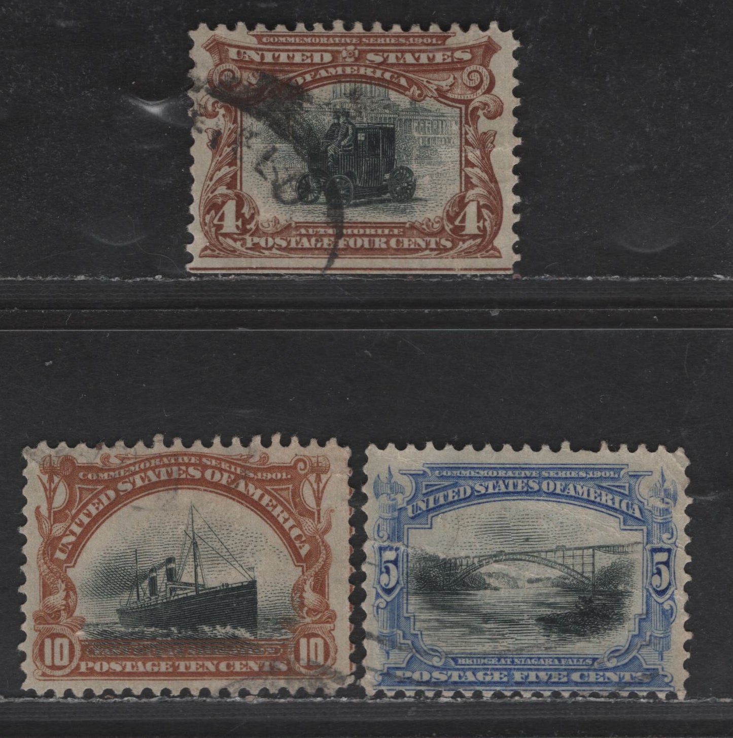 Lot 245 (C) United States Of America SC#296, 297, 299 4c, 5c, 10c Brown/Ultra/Orange Brown & Black Electric Car - Fast Ocean Navigation, 1901 Pan American Exposition Issue, 3 VG & VF Used Singles Small Tear On 4c, Internal Crease On 5c