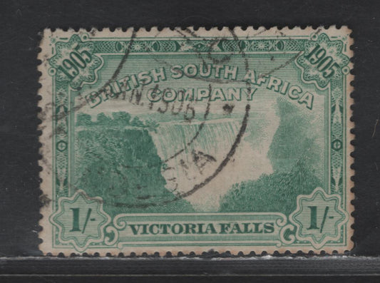 Lot 308  (C) Rhodesia SG#97 1/- Blue Green Victoria Falls, 1905 Opening Of Victory Falls Bridge Issue, A Very Good Used Single, Perf 14, Pulled Perf At Bottom