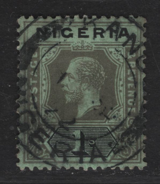Lot 128 Nigeria SG#8e 1/- Brownish Gray & Black - Deep Gray & Black King George V, 1914-1929 KGV Imperium Keyplate Issue, Wmk Multiple Crown CA, A Fine Used Single, Emerald Paper With Pale Olive Back, April 1, 1922 Kano CDS