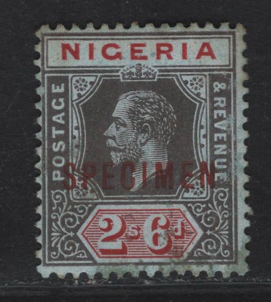 Lot 133 Nigeria SG#9s 2/6 Gray Black & Deep Red  King George V, 1914-1929 KGV Imperium Keyplate Issue, Wmk Multiple Crown CA, A Very Good Unused Single, Pale Blue Paper With Blue Back, Red Specimen Overprint, Scarce, With Less Only 400 Issued.
