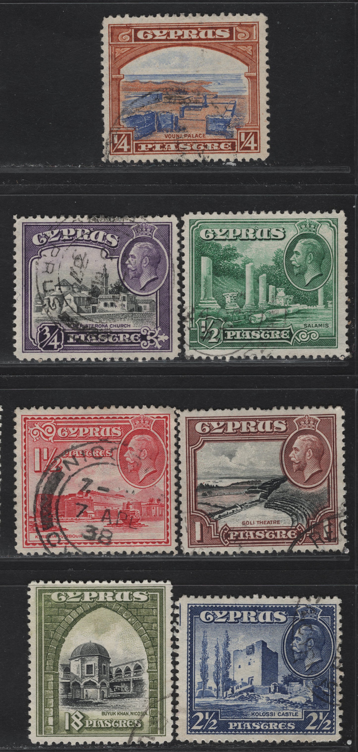 Lot 102 Cyprus SG#133-138, 142 1/4pi - 18pi Ultramarine & Orange Brown - Black & Olive Green Ruins of Vouni Palace - Buyuk Khan, 1934 Pictorial Issue, 7 Very Fine Used Singles, Key Value Is The 18pi