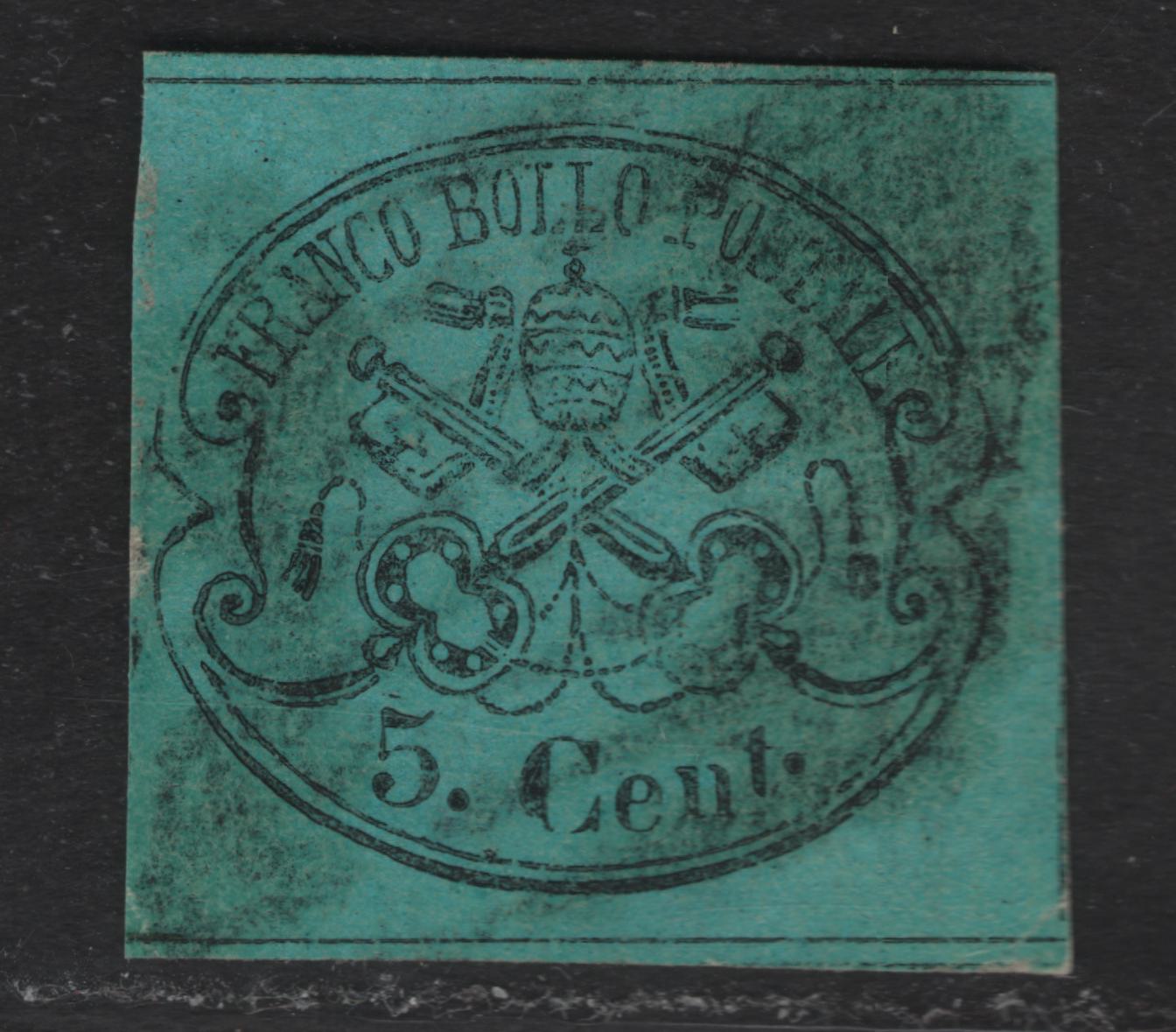 Lot 28 Roman States SC#14 5c Black on Light Blue Papal Arms, 1867 Arms Issue, A Very Good Used Single, Glazed Paper, Traces Of Dividing Lines On 3 Sides, Narrow Margin At left, Paper & Color Identical To Lot 26 Which Is A Known Genuine Stamp.