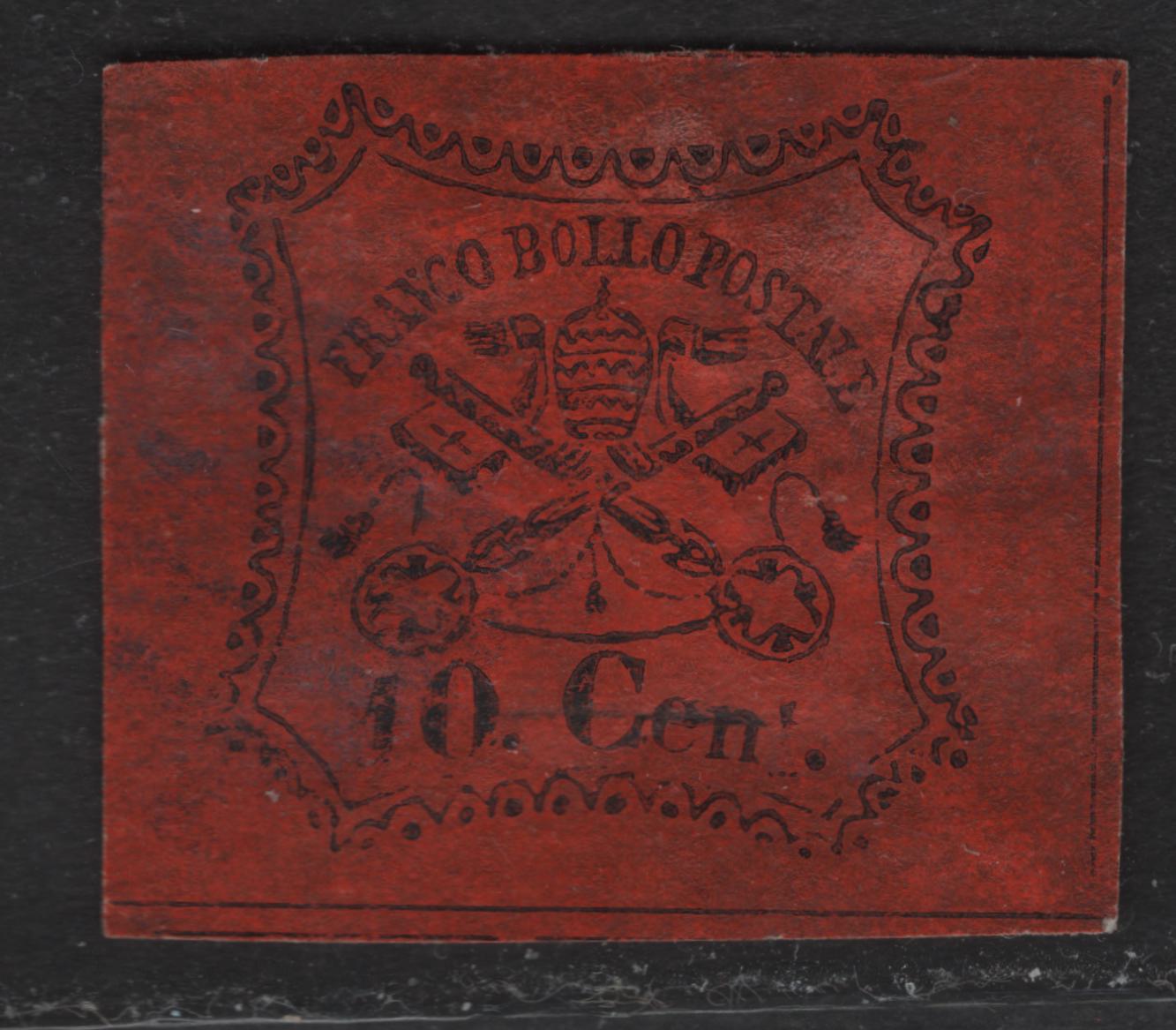 Lot 30 Roman States SC#15 10c Black on Vermillion Papal Arms, 1867 Arms Issue, A Very Fine Used Single, Glazed Paper, Dividing Lines on 3 Sides, T of Cent Almost Missing, Horizontal Lines At Base Are Continuous.