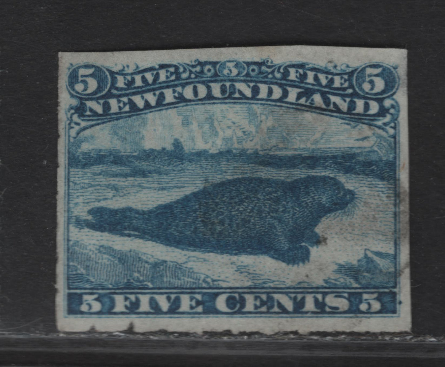 Lot 26 (C) Newfoundland #40 5c Blue Harp Seal, 1876-1879 3rd Cents Issue, A Fine Used Rouletted Single, Paper Cents-GG, Rouletted Have Been Trimmed On Two Sides