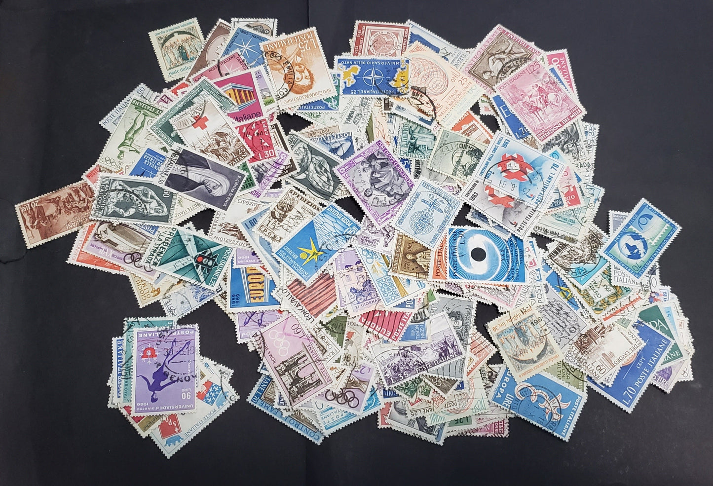 Lot 308 Italy 1956-1969 Commemorative Issues, 600-800 F-VF Used Singles In Three Large Glassine Envelopes, Unchecked For  Paper Fluorescence & Tagging Varieties, Ideal For Further Study