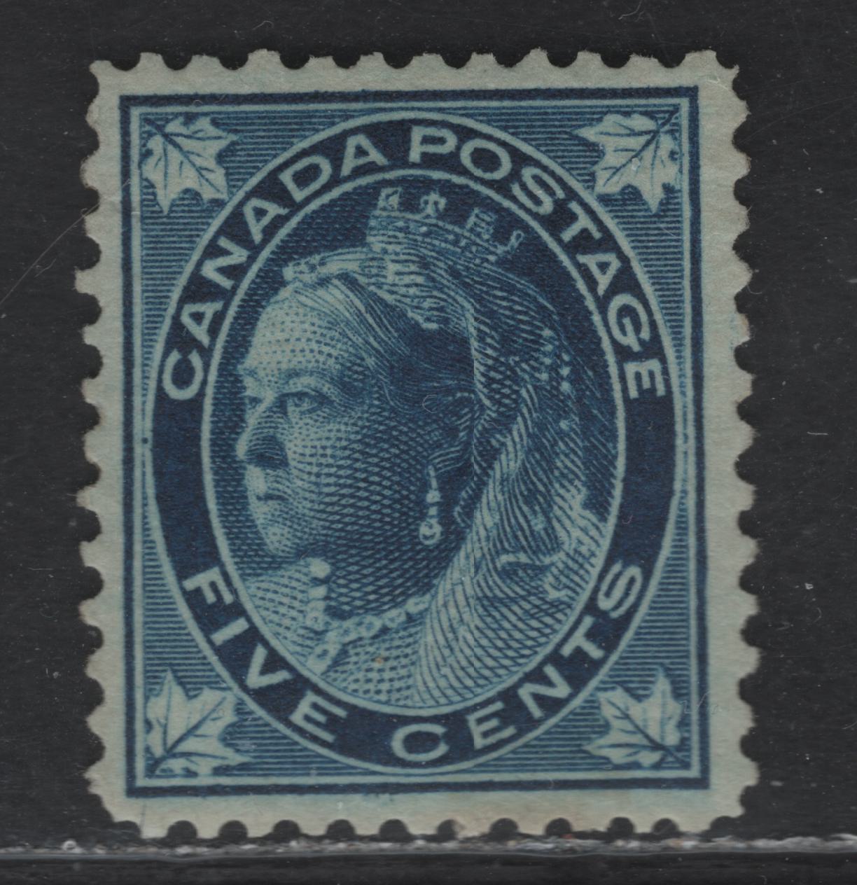 Lot 107 (C) Canada #70 5c Dark Blue Queen Victoria, 1897-1898 Maple Leaf Issue, A VFOG Single, Paper ABN-FF, Perf 12, Guide Dot At Center Left Of Portrait Medallion, Design Size 17.4x20.8mm.
