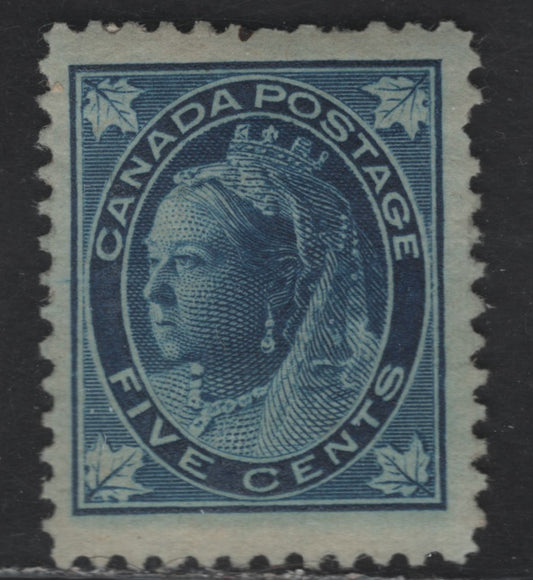 Lot 108 (C)  Canada #70 5c Dark Blue Queen Victoria, 1897-1898 Maple Leaf Issue, A VGOG Single, Paper ABN-FF, Perf 12, Pulled Perfs, Gum Is Full But is Largely Covered By Album Page Adhesions.