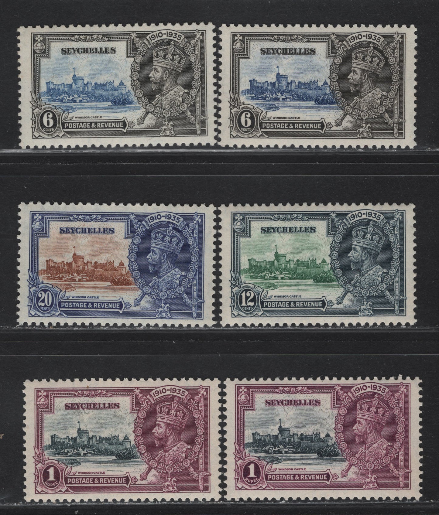 Lot 276 Seychelles SG#128-131 6c - 1r Ultramarine & Gray Black - Slate & Purple KGV & Windsor Castle, 1935 Silver Jubilee Issue, 6 VFNH Singles, Shade Lot, Showing Two Different Shades Of 6c & 1r
