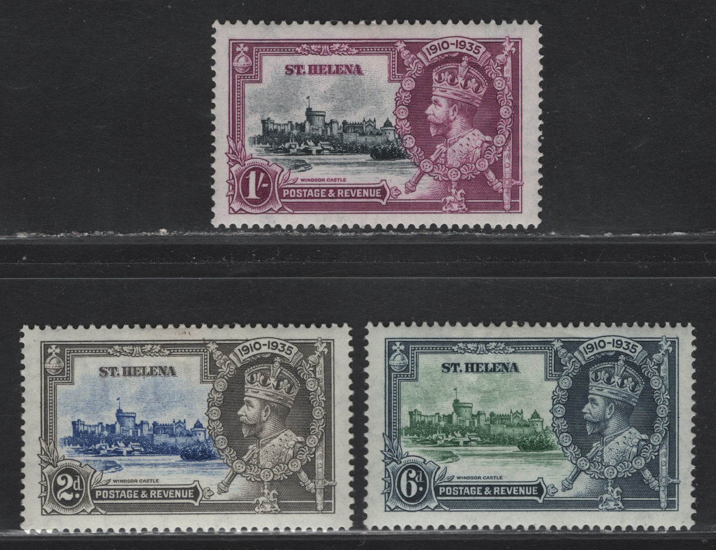 Lot 99 St Helena SG#125-127 2d - 1/- Ultramarine & Gray - Slate & Purple KGV & Windsor Castle, 1935 Silver Jubilee Issue, 3 VFOG Singles, Partial Hinged Set