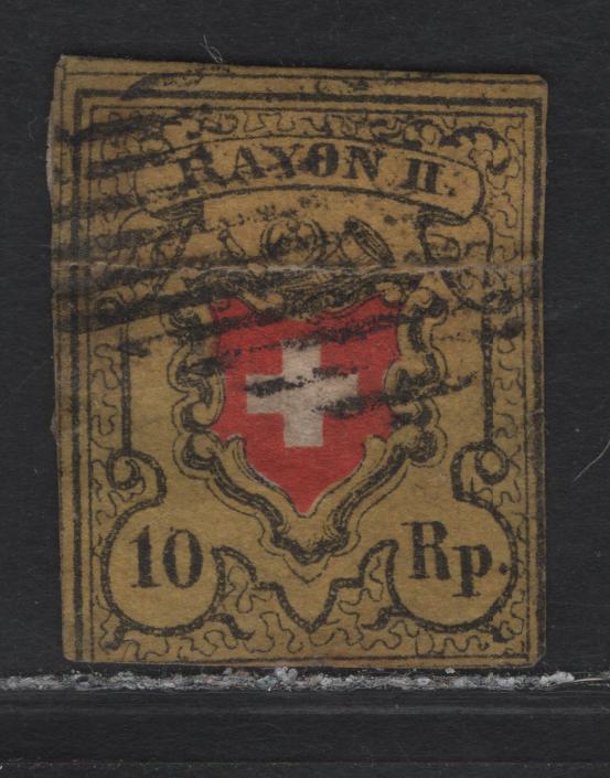 Lot 224 Switzerland SC#8b 10r Orange Yellow, Black & Red Rayon District, 1850 Rayon District Issue, An Ungraded Used Single, Presentable Spacefiller, Major Faults, Including A Large Tear Which Has been Repaired & A Corner Thin.