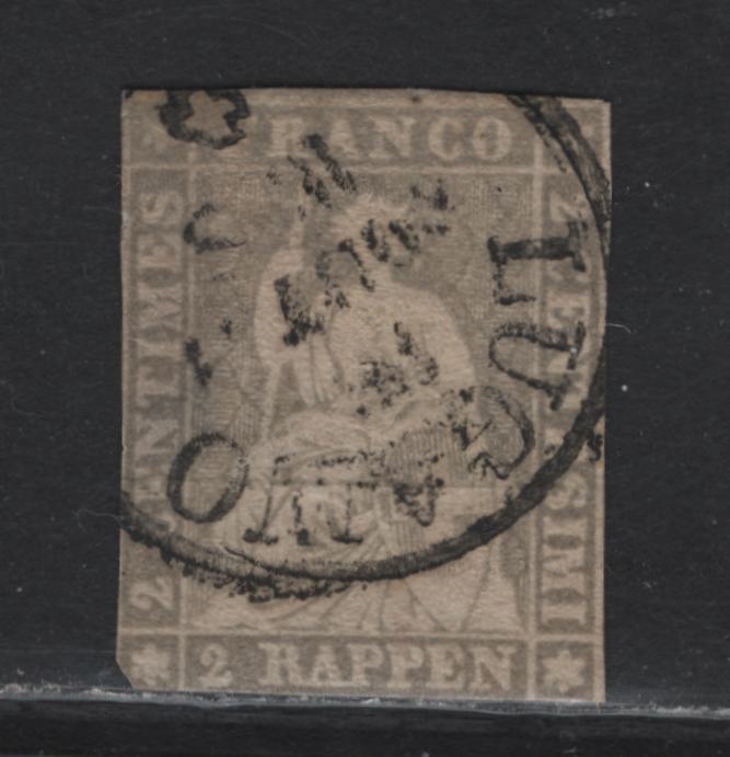 Lot 70 Switzerland SC#35 2r Gray Helvetia, 1858-1862 Strubel Issue, An Ungraded Used Single, Green Silk Threads, No Margins To Speak Of, Truncated LR Corner & Shallow Thin.