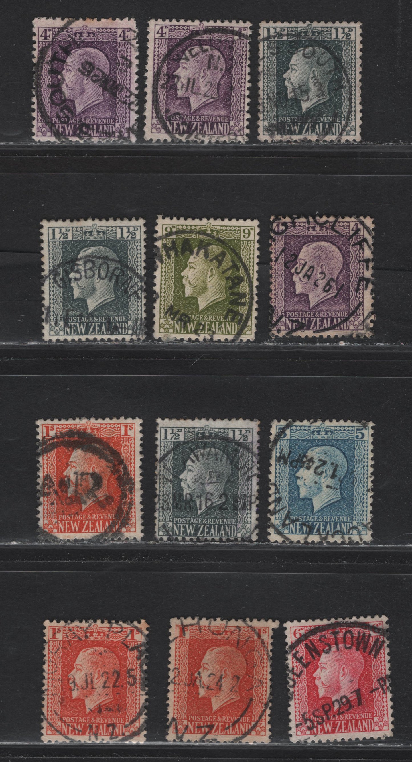 Lot 109 New Zealand (C) SG#416,a, 422, 424-425, 429-430,c 135d - 1/- Gray-Slate - Vermillion King George V, 1915-1930 KGV Profile Head Issue, 12 Very Good/Fine/Very Fine Used Singles, Perfs 14x13.5 & 14x14.5, SON Town Cancels