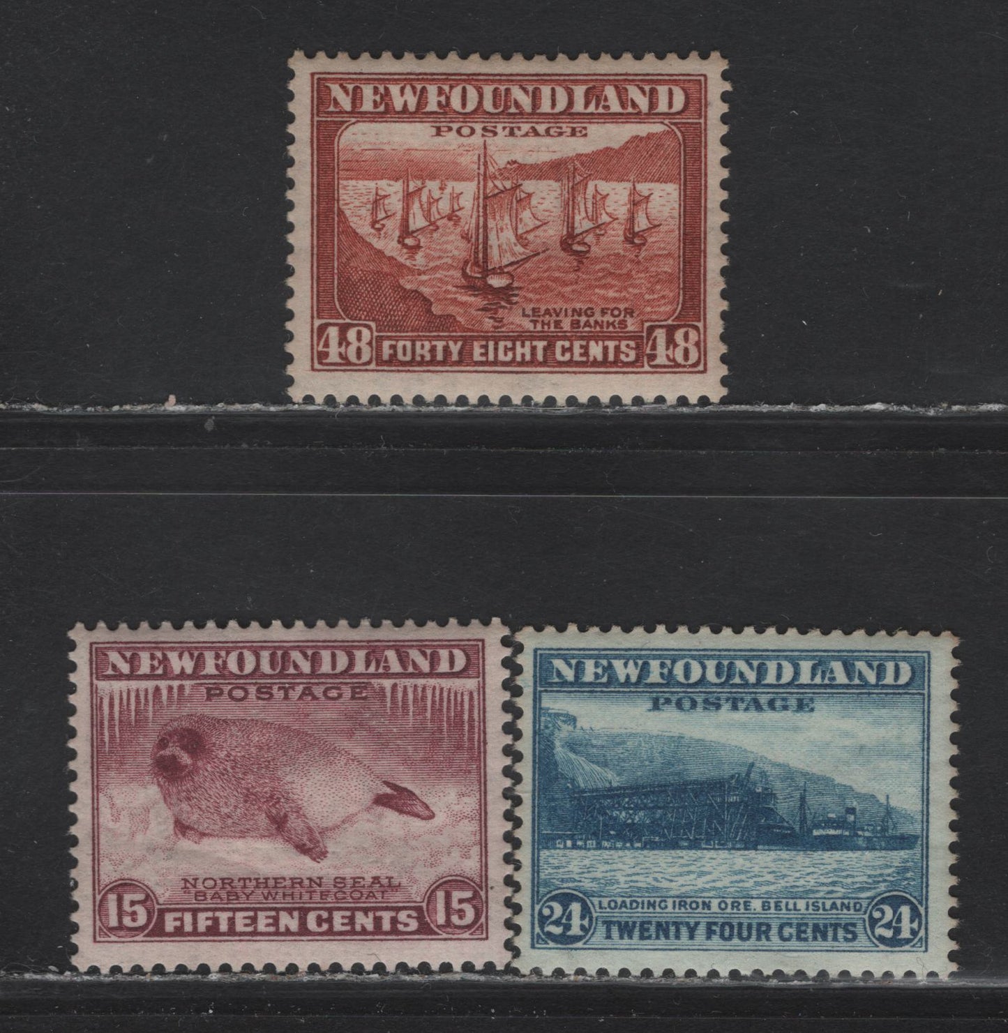 Lot 192 Newfoundland #195, 199, 210 15c-48c Magenta - Prussian Blue Seal - Loading Iron Ore Bell Island, 1932-1937 Perkins Bacon Resources Issue, 3 Fine & VFOG Singles