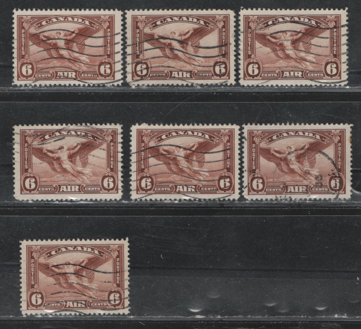 Lot 387 Canada #C5 6c Red Brown Daedalus In Flight, 1935 Airmail Issue, 7 Fine/Very Fine Used Singles, Shade Lot Showing Range In Which The Red Brown Can Be Found