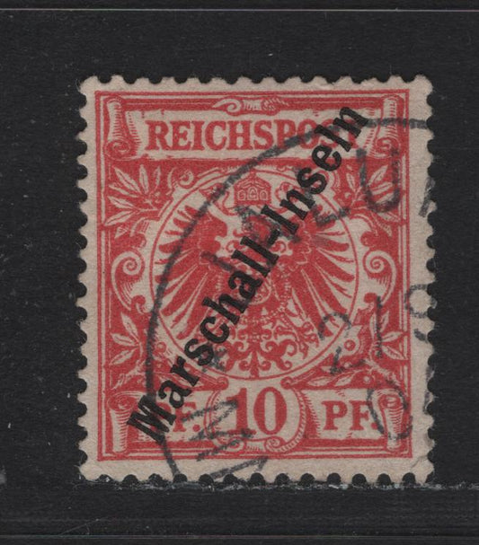 Lot 135 Marshall Islands SC#3 10pf Carmine , 1897 Arms Issue, A Very Good Used Single, Berlin Overprint, Forged Cancel, Small Corner Crease (LR Corner).