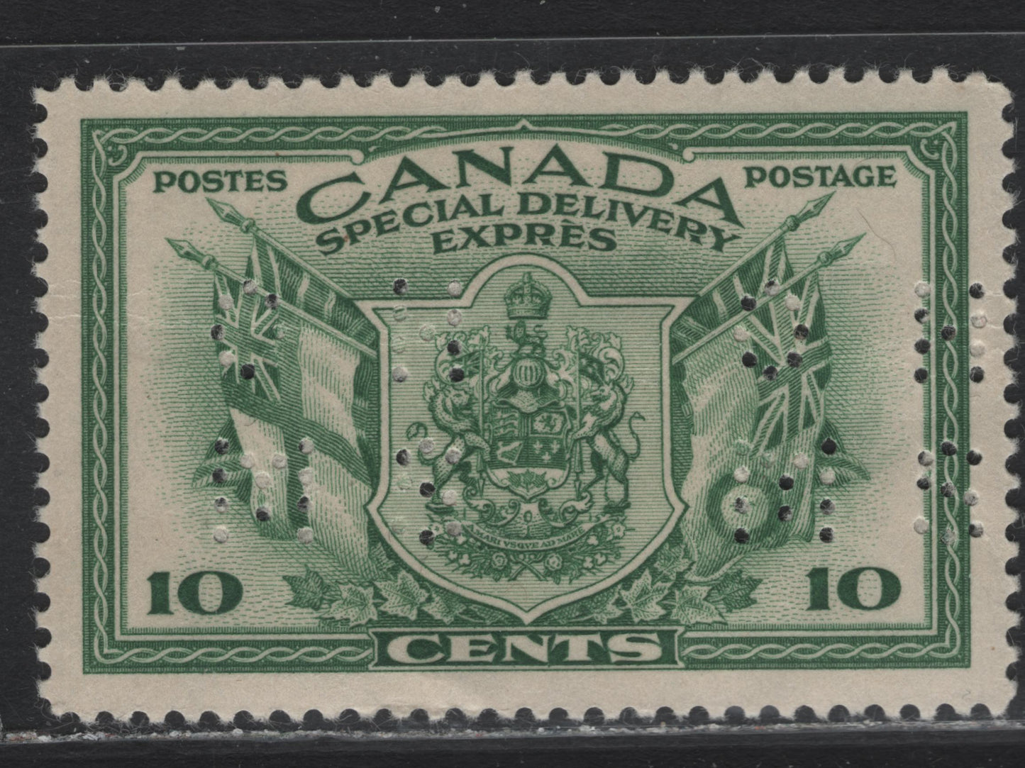 Lot 276 Canada (C) #O9-E10 10c Green Arms & Flags, 1942 War Issue Special Delivery, A VFOG Single, CBN-IIIII Paper, Perf 11.9x12, 4-Hole OHMS Perfin, Original Die, Pos. 1, Small Internal Wrinkles.