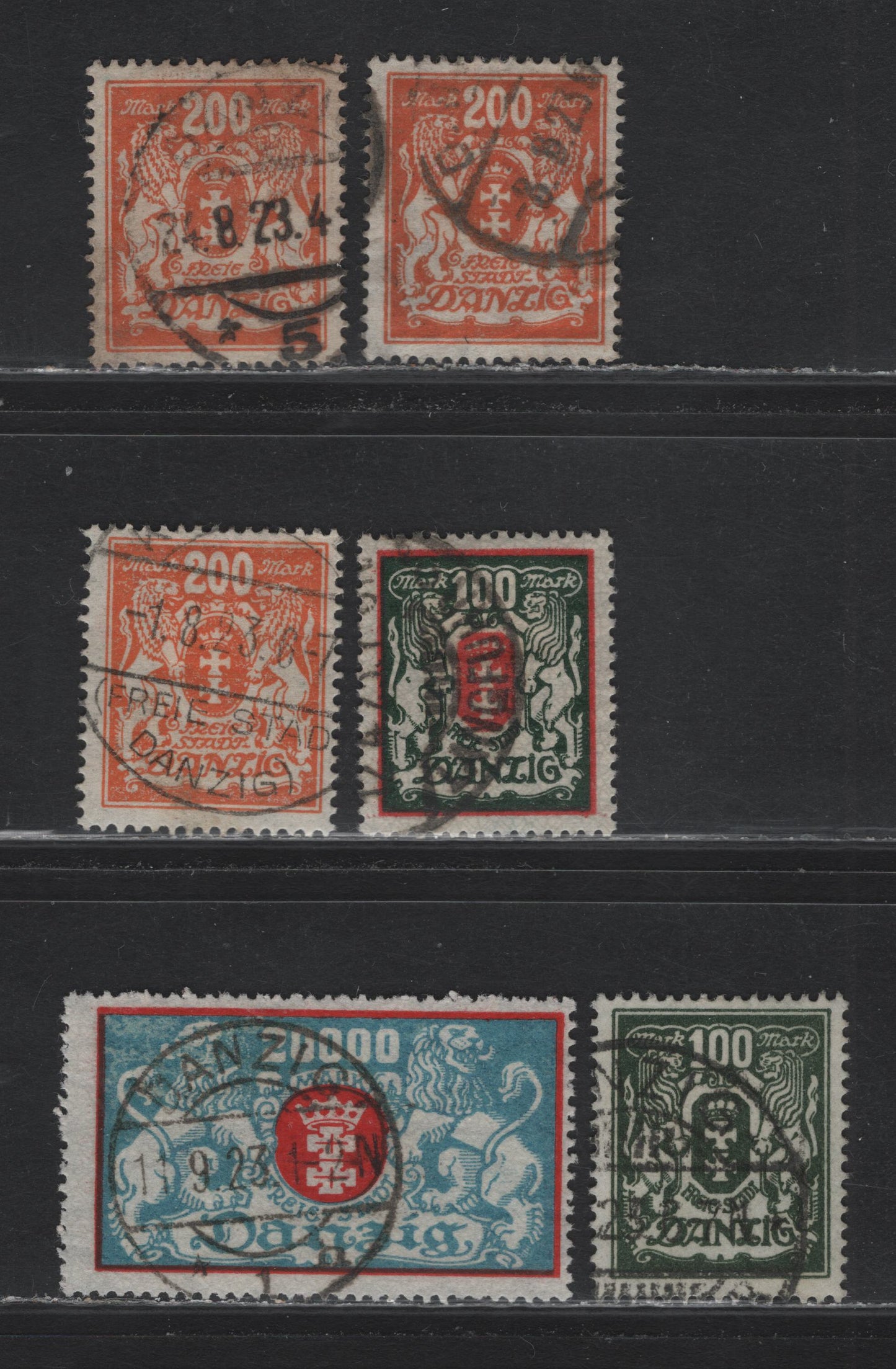 Lot 299 Danzig SC#107, 114-115, 124 (Michel# 128x, 141,148, 142) 100m - 20,000m Dark Green & Red - Pale Blue & Red , 1922-1923 Arms Issue, 4 Fine/Very Fine Used Singles, 3 Shades Of Orange On the 200m Webbing Wmk All Genuine Postal Cancels Except 1.