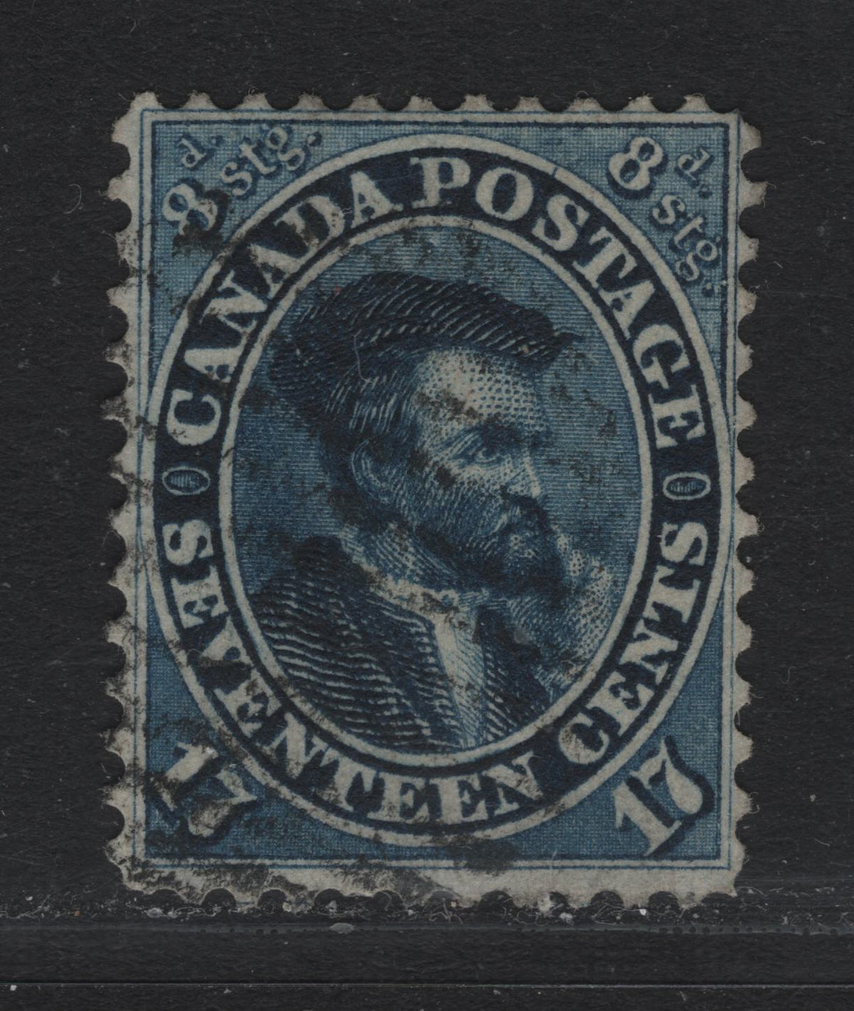Lot 365 Canada #19 17c Blue , 1859-1864 First Cents Issue, A Very Good Used Single, Cents-C Paper, Perf 12, Showing Line Into Outer Medallion Between GE of Postage, Plate Dot Inside Left Medallion Ornament.