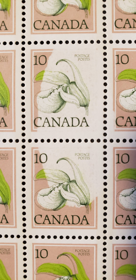 Lot 9 Canada #711a 10c Ochre & Multicoloured Lady's Slipper, 1977 Floral Definitives, A VFNH Full Sheet Field Stock Sheet of 100 Showing Dramatic Repellex Error on Positions 67-68 and 77
