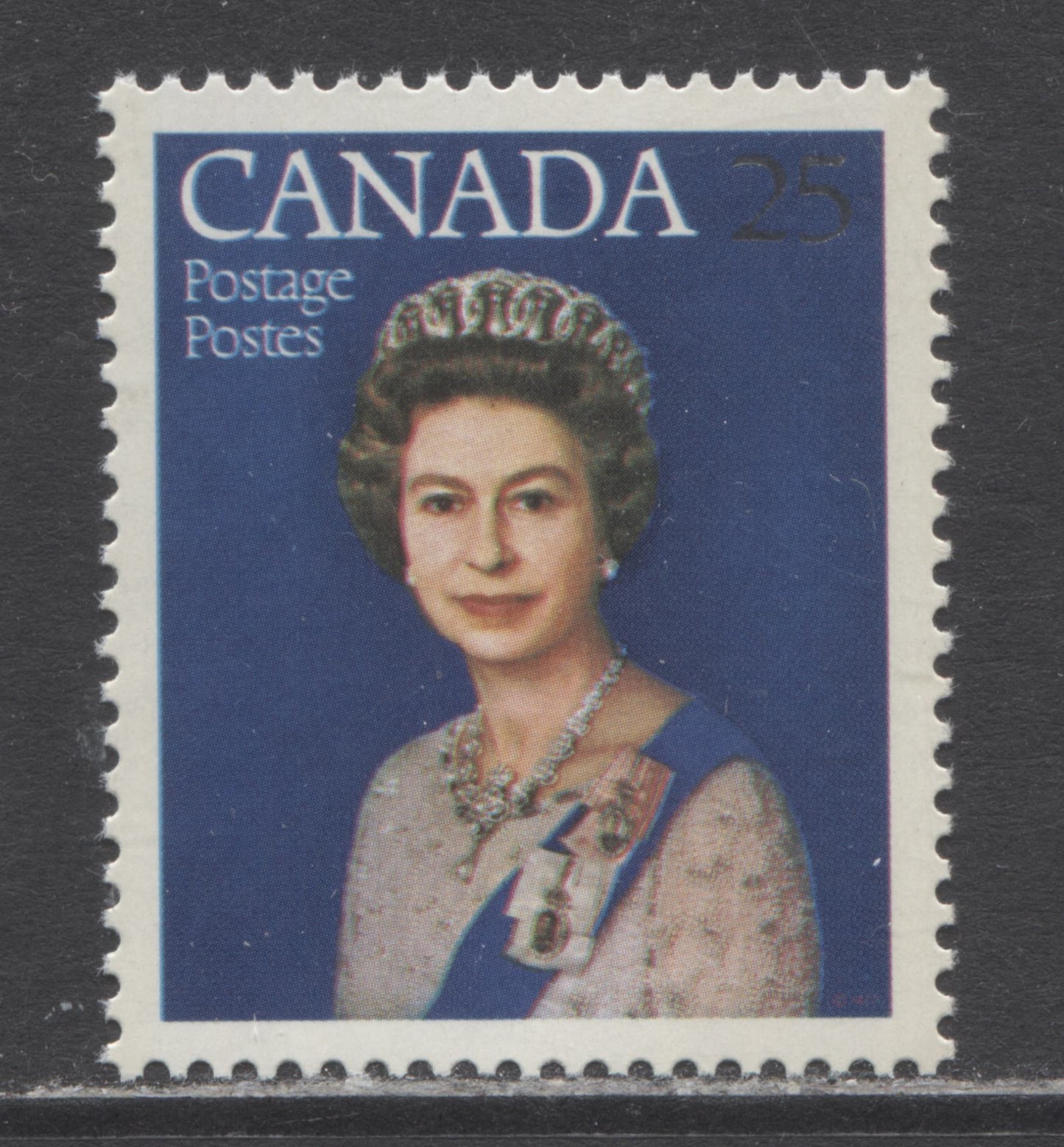 Lot 44 Canada #704iivar 25c Silver & Multicolored Queen Elizabeth II, 1977 Silver Jubilee Issue, A VFNH Single With Blurry Inscription Due To Color Shift, DF-fl Paper
