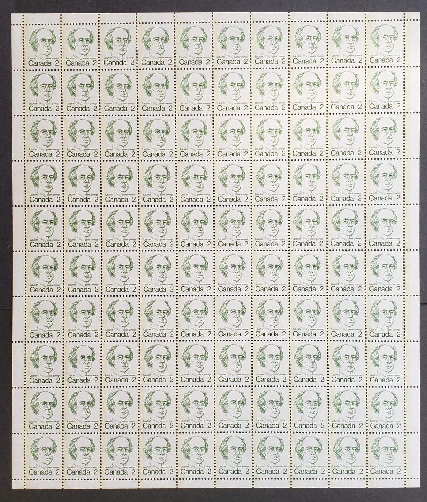 Lot 99 Canada #587v 2c Paler Green Laurier, 1973-1976 Caricature Definitives Issue, A VFNH Full Field Stock Sheet Of 100 On DF/DF Horizontally Ribbed Paper With Light Cream Coloured Tagging