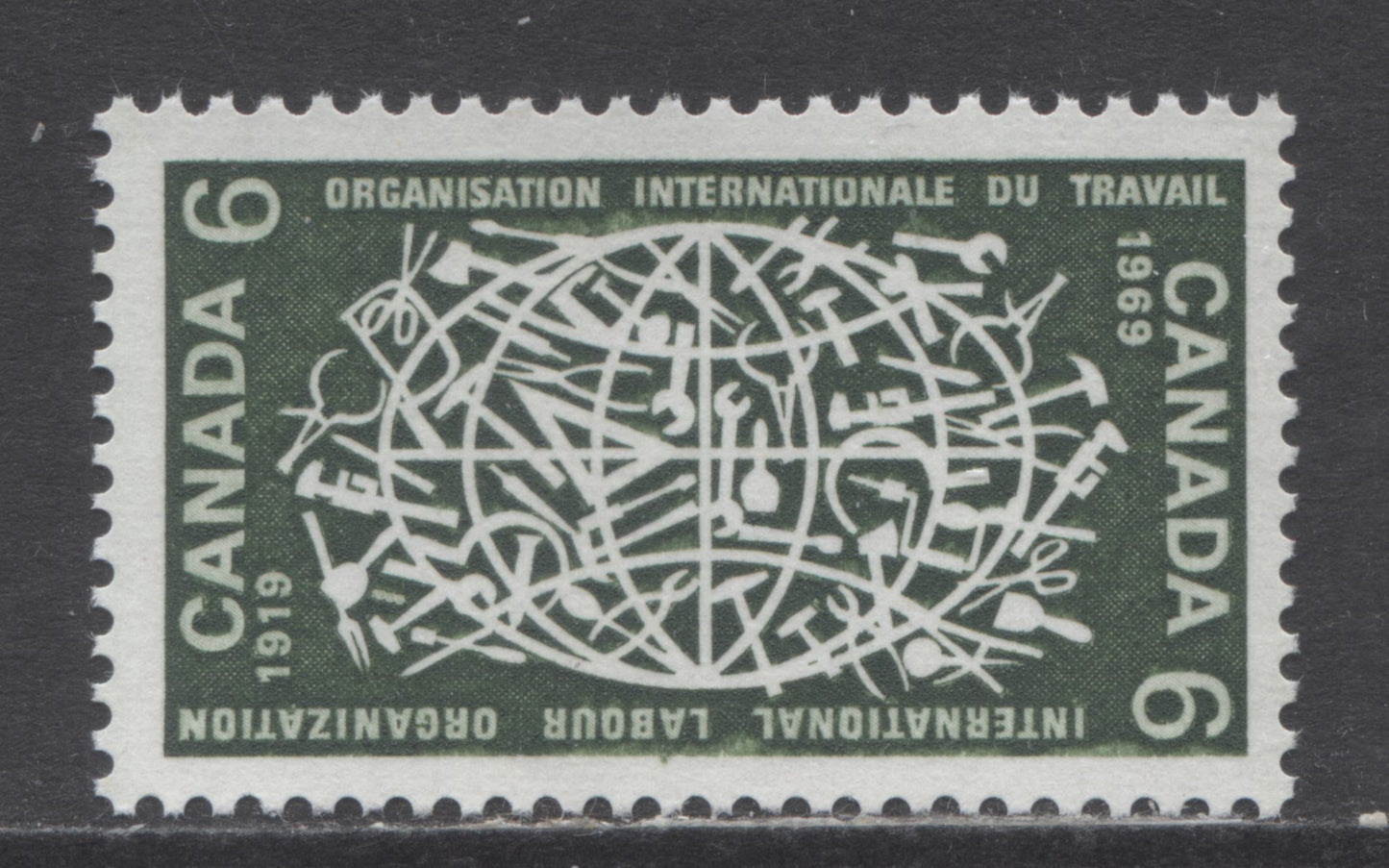 Canada #493 var 6c Dark Olive Green Globe And Tools, 1969 I.L.O Issue, A VFNH Single On HB Paper, Vertical Ribbed, Weak Entry At Left And Right