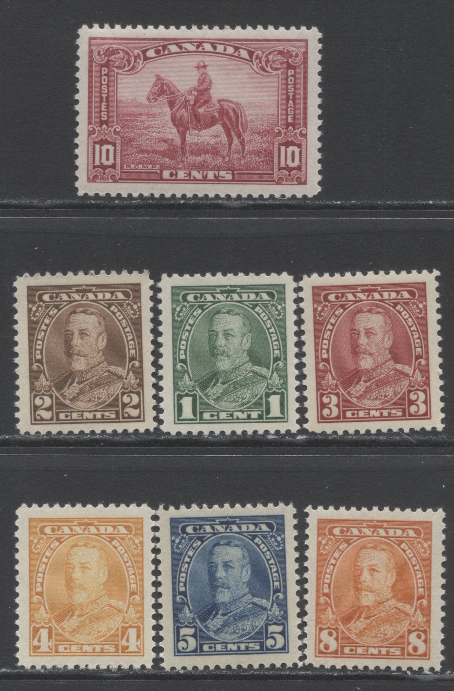 Lot 186 Canada #217-223 1c - 10c Green - Carmine Rose King George V - RCMP, 1935 KGV Pictorial Issue, 7 VFNH/LH Singles With Deep Cream Gum