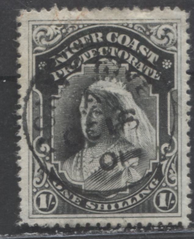 Lot 269 Niger Coast SC#61(SG#72a) One Shilling Black 1897 - 1898 Watermarked Issue, Perf 13.5 - 14, A Fine - Very Fine Used Example, Click on Listing to See ALL Pictures, 2022 Scott Classic Cat. $32.5 USD