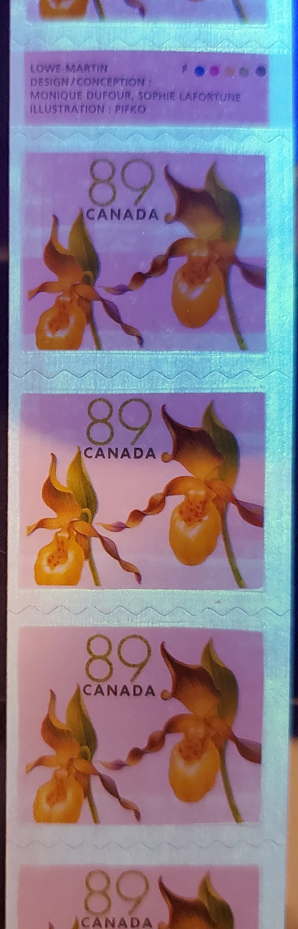 Lot 45 Canada #2129ix 89c Multicolored Yellow Lady's Slipper, 2005-2006 Flower Definitives (2) - Coils, A VFNH Gutter Strip Of 9 On DF Fasson Paper With Compound Cut Between Stamps 6&7. Has Considerable Ghost Tagging Bars Throughout Strip $173